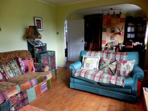The living room in Corinne Young's home, with furniture embellished by Corinne. Photo by Jonathan Gawthorpe for Yorkshire Post Magazine (June 2014).