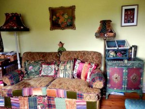 The living room in Corinne Young's home, with furniture embellished by Corinne. Photo by Jonathan Gawthorpe for Yorkshire Post Magazine (June 2014).