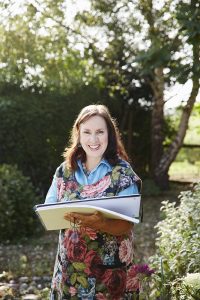 Textile artist Corinne Young sketching in the garden. Photo by Alun Callender for Country Living Magazine (September 2017).