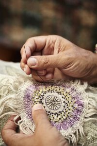 Textile artist Corinne Young hand-embroidering a passion flower. Photo by Alun Callender for Country Living Magazine (September 2017).