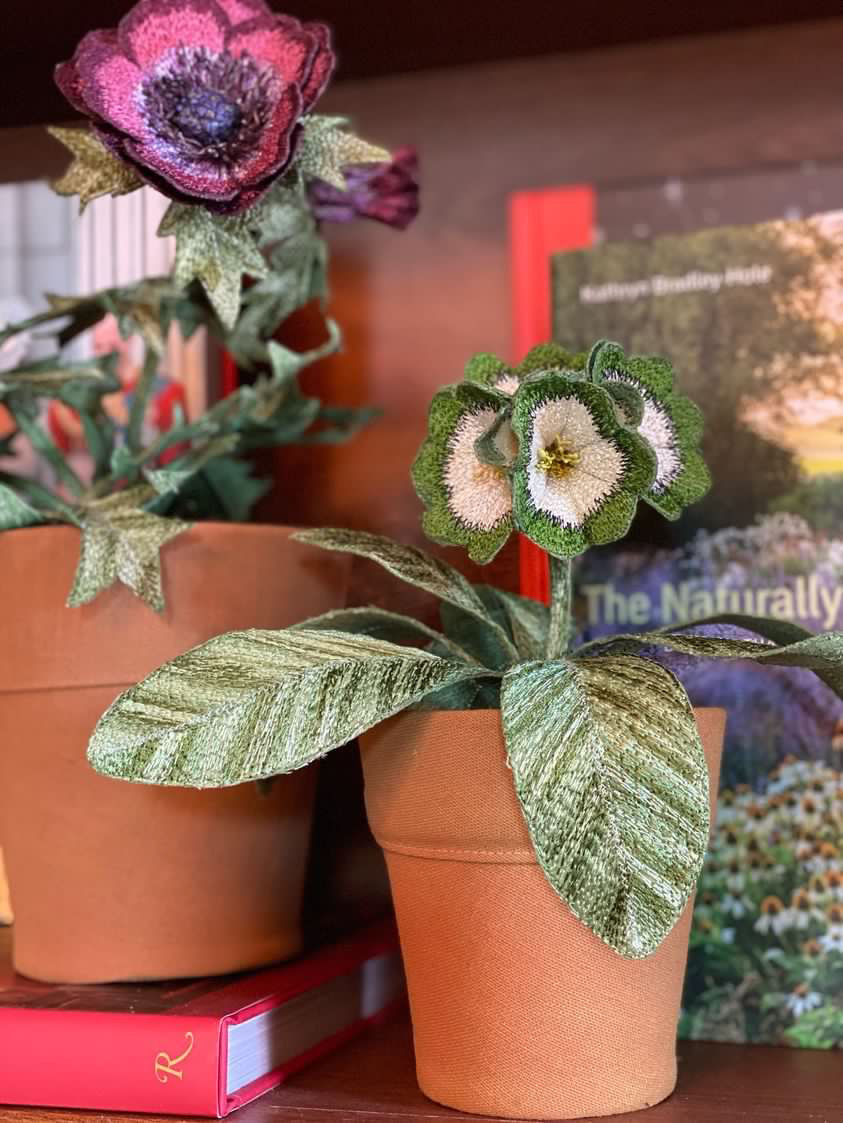 Embroidered pot plant sculptures by textile artist Corinne Young on display in the Library Room, Lanesborough Hotel, London (May 2023).