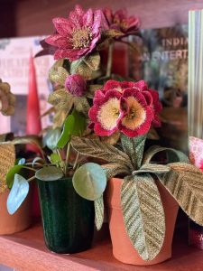 Embroidered pot plant sculptures by textile artist Corinne Young on display in the Library Room, Lanesborough Hotel, London (May 2023).