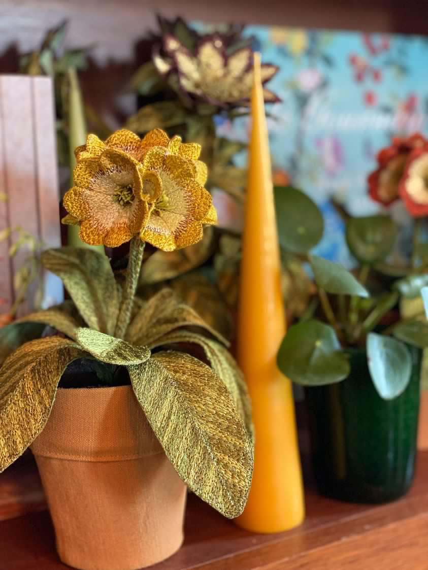 Embroidered pot plant sculptures by textile artist Corinne Young on display in the Library Room, Lanesborough Hotel, London (May 2023).