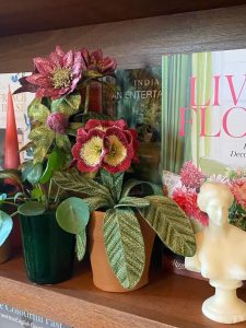 Embroidered pot plant sculptures by textile artist Corinne Young on display in the Library Room, Lanesborough Hotel, London (May 2023).