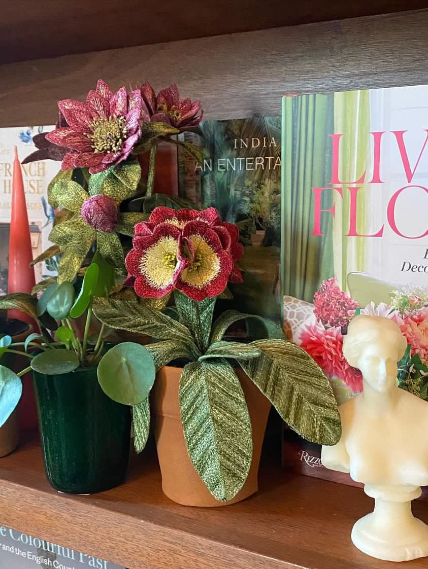 Embroidered pot plant sculptures by textile artist Corinne Young on display in the Library Room, Lanesborough Hotel, London (May 2023).