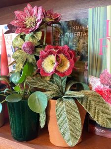 Embroidered pot plant sculptures by textile artist Corinne Young on display in the Library Room, Lanesborough Hotel, London (May 2023).