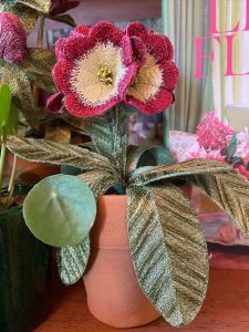 Embroidered pot plant sculptures by textile artist Corinne Young on display in the Library Room, Lanesborough Hotel, London (May 2023).