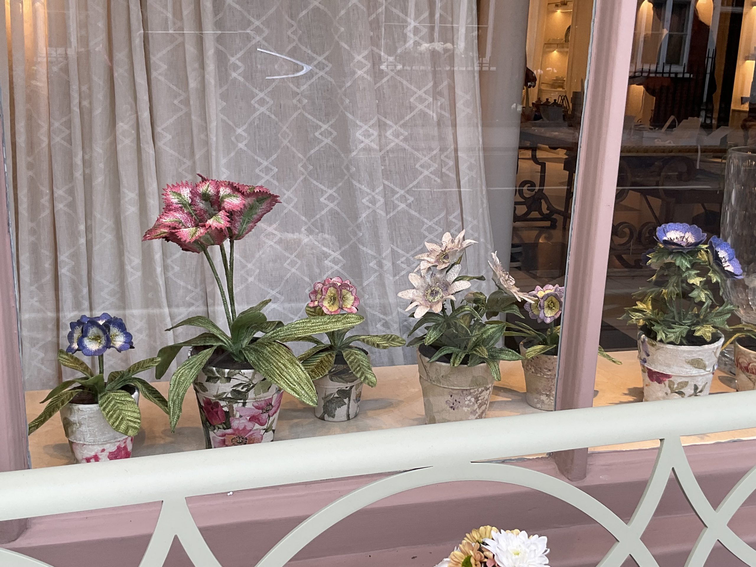 Embroidered pot plants by Corinne Young on display in the window of Bonadea, London.