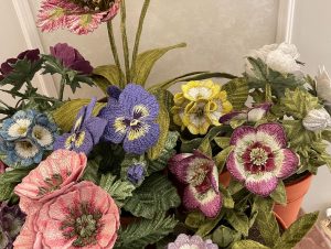 Embroidered pot plants by Corinne Young on display at Bonadea, London.
