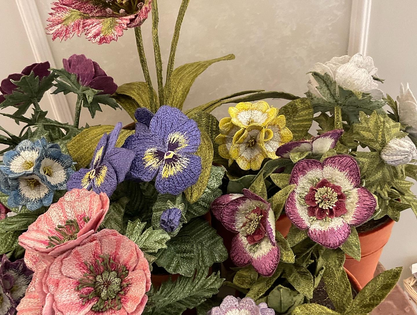 Embroidered pot plants by Corinne Young on display at Bonadea, London.