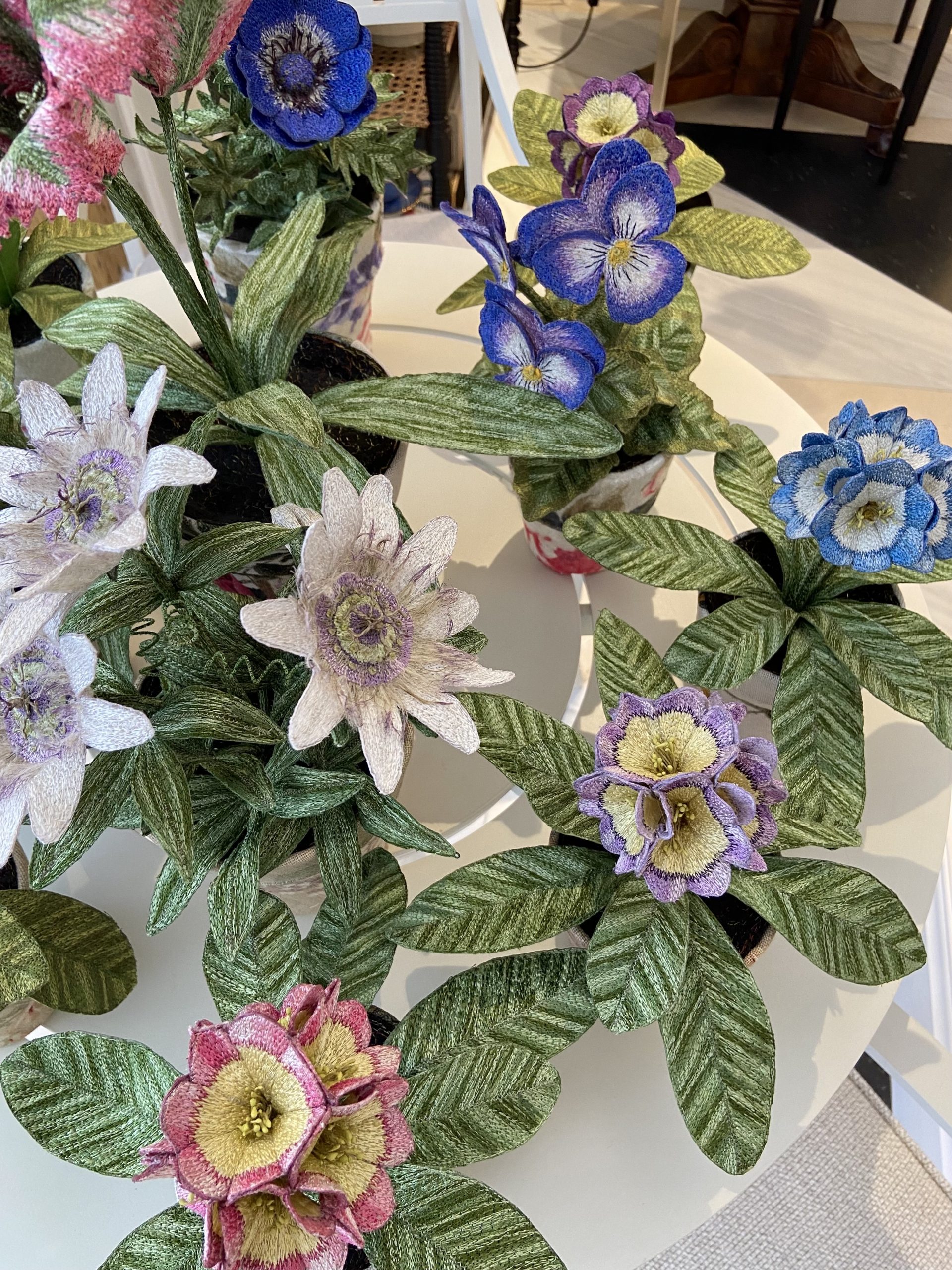 Embroidered pot plants by Corinne Young on display at Bonadea, London.
