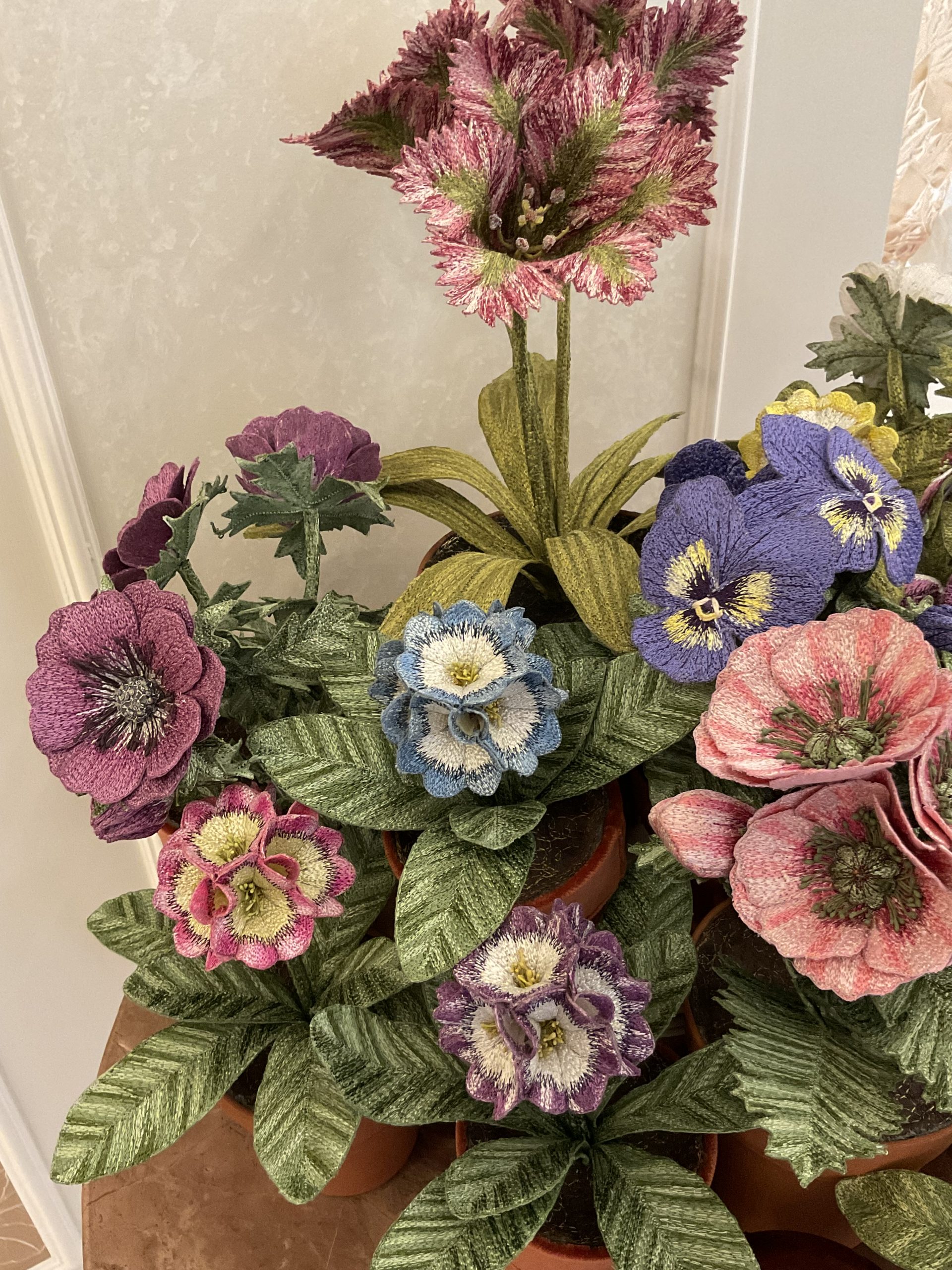Embroidered pot plants by Corinne Young on display at Bonadea, London.